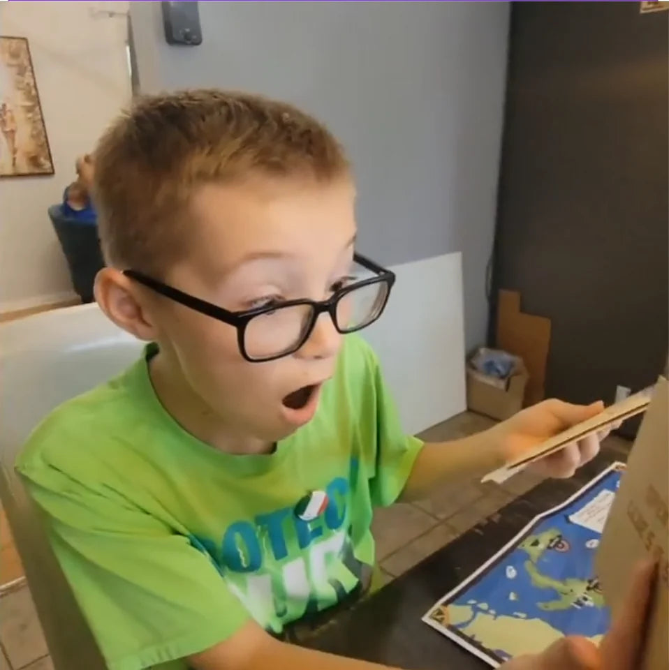 A boy reacting to a clue while solving a mission